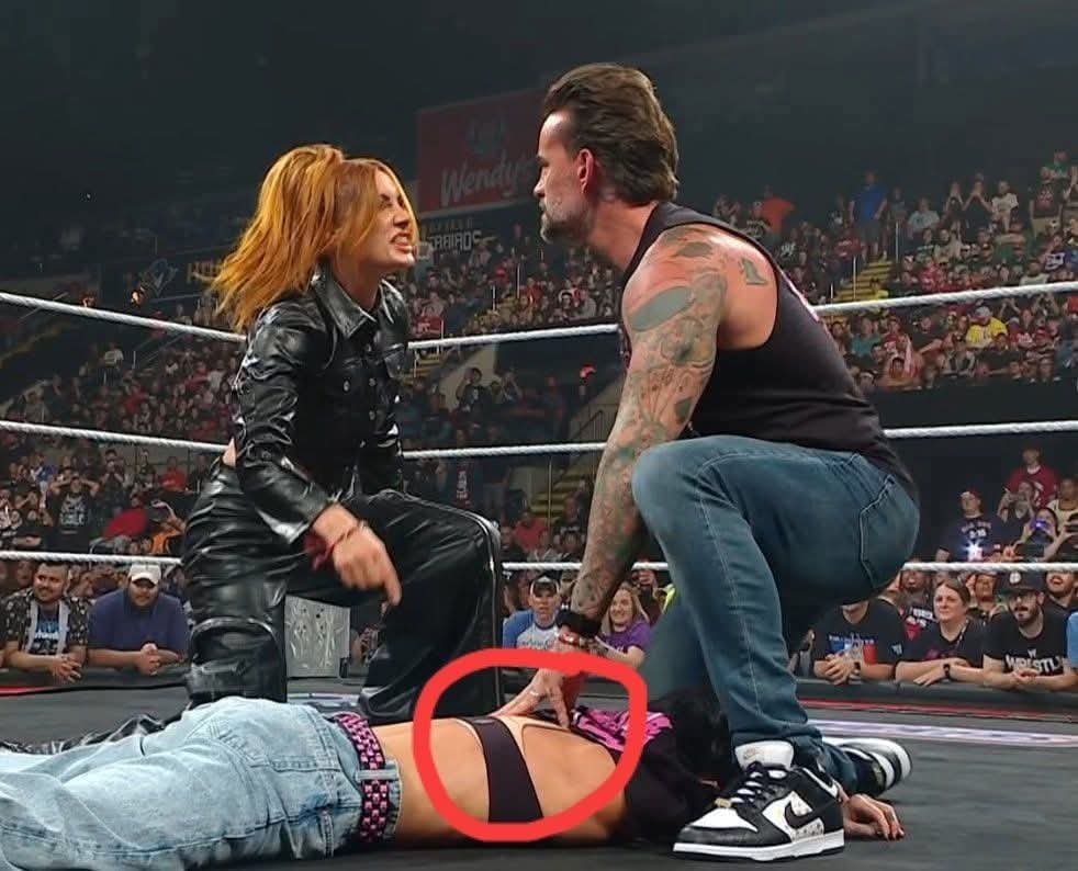 Becky Manhandle slams AJ Lee. Becky slaps CM Punk.